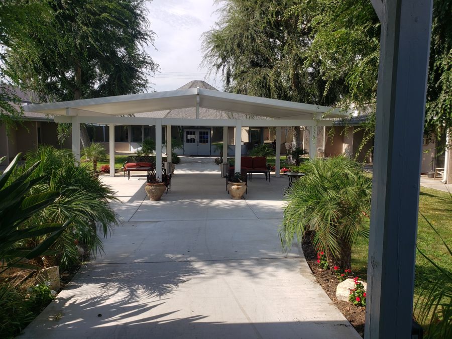 Commercial gable shade structure over a courtyard